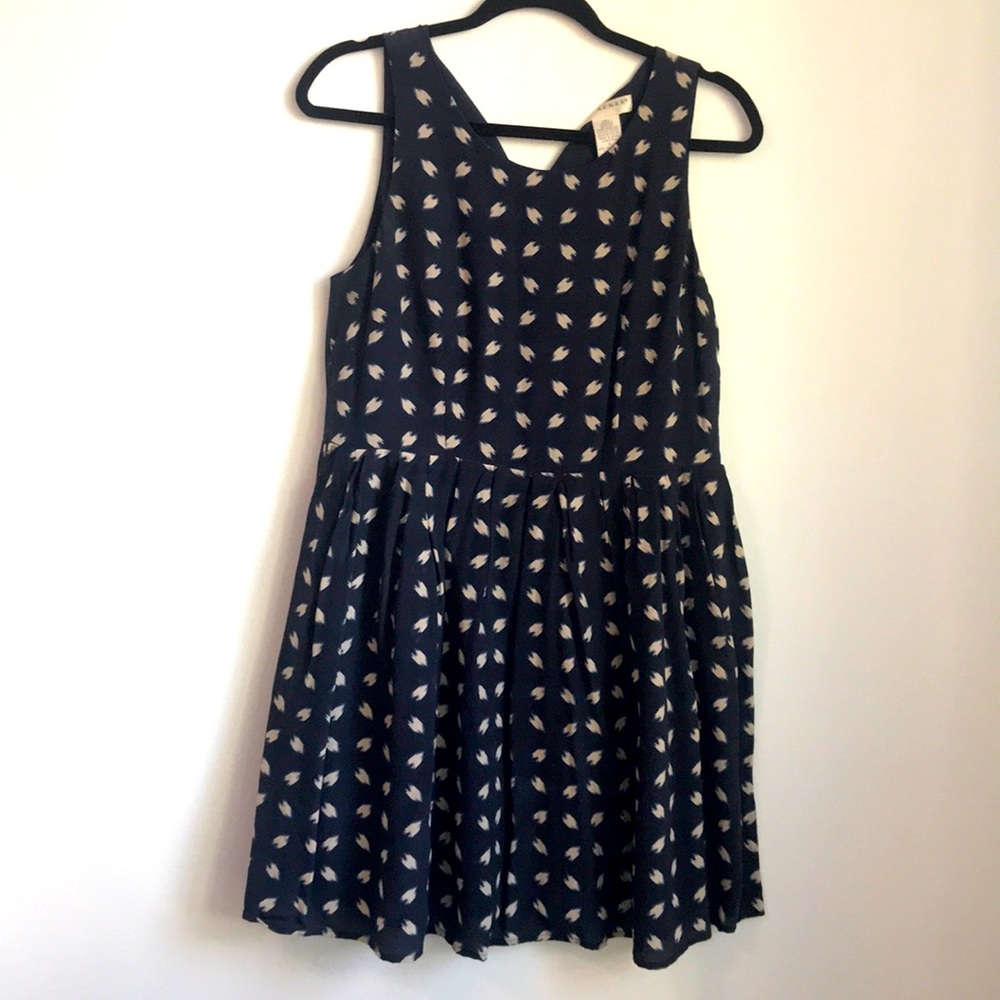 Navy and beige sleeveless dress with pleated skirt